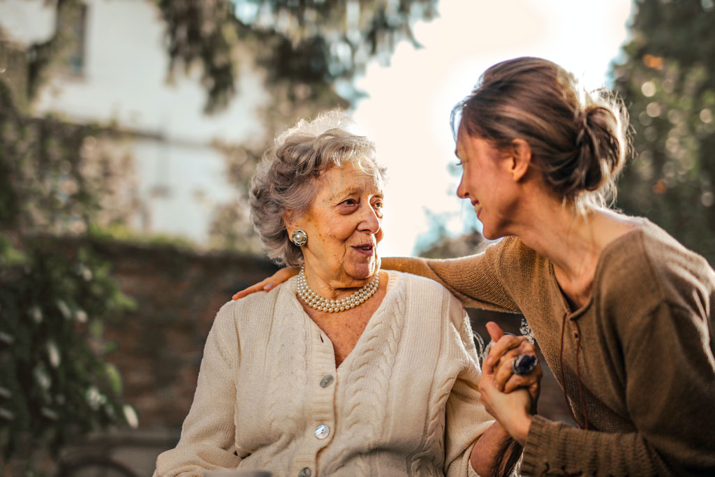 Younger woman visiting her grandmother