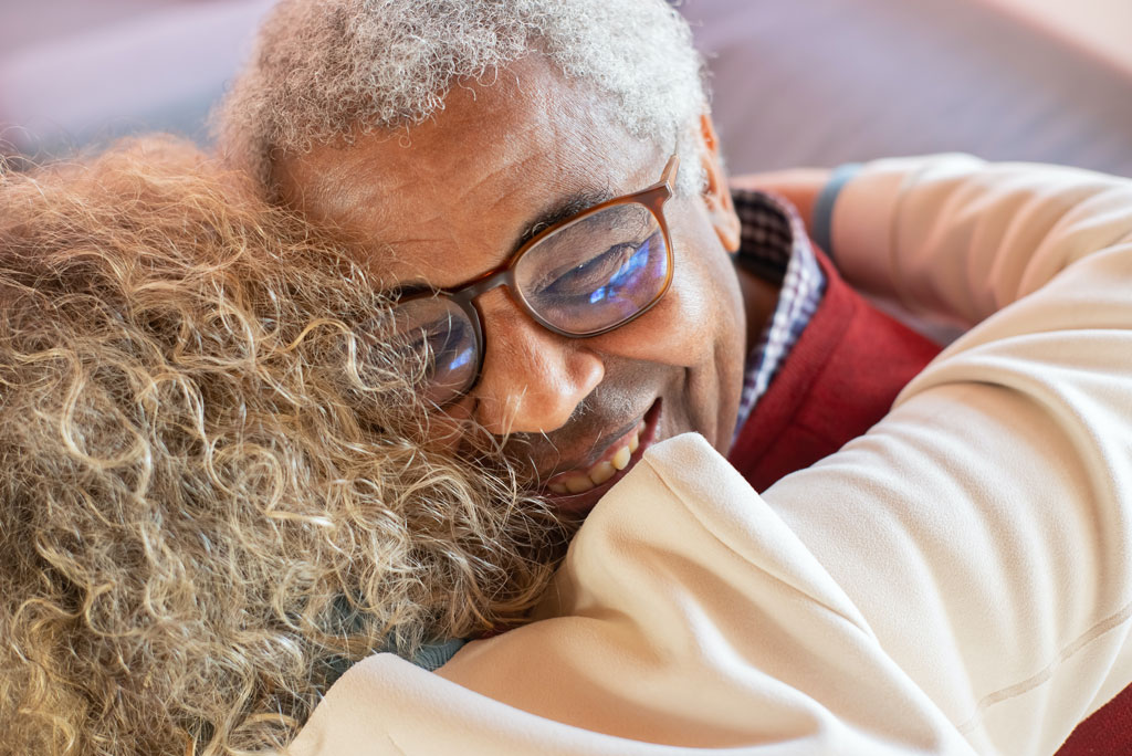 Happy older couple hugging