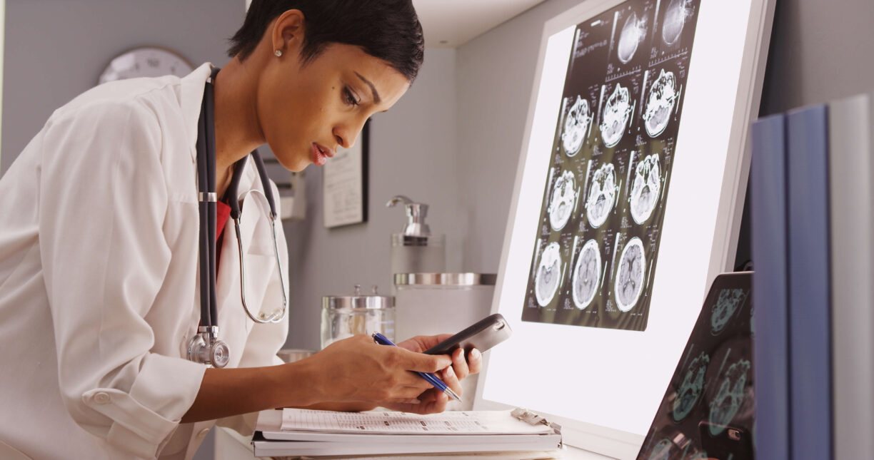 Doctor By Brain Scans Looking at Phone
